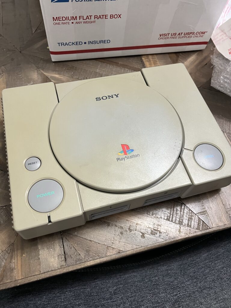 A somewhat yellowed PlayStation.